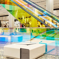 OMA adds iridescent glass escalator to New York's Saks Fifth Avenue